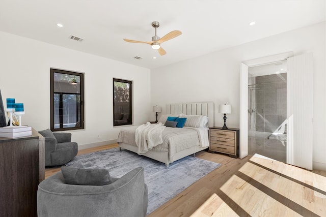 bedroom with ceiling fan and light hardwood / wood-style floors