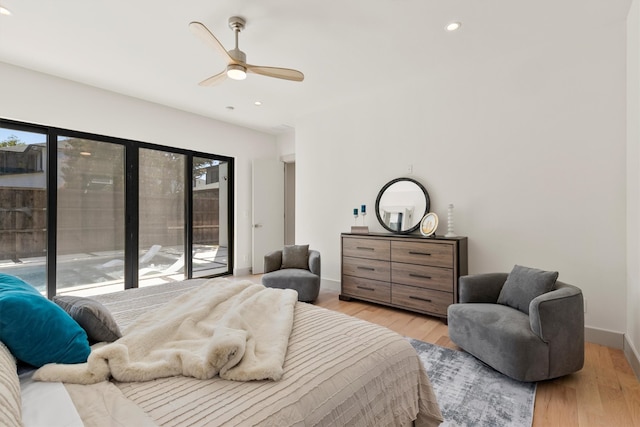 bedroom with access to outside, light hardwood / wood-style flooring, and ceiling fan