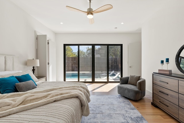 bedroom featuring access to outside, ceiling fan, and light hardwood / wood-style flooring