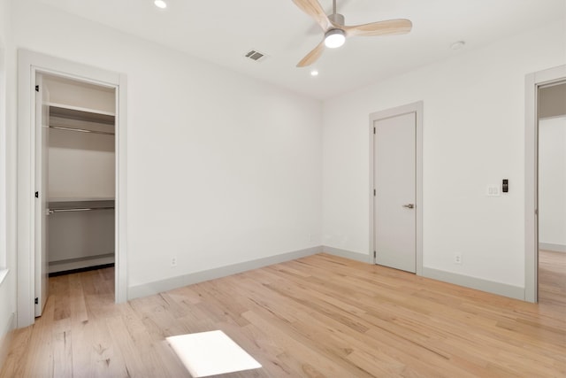 unfurnished bedroom with ceiling fan and light hardwood / wood-style flooring