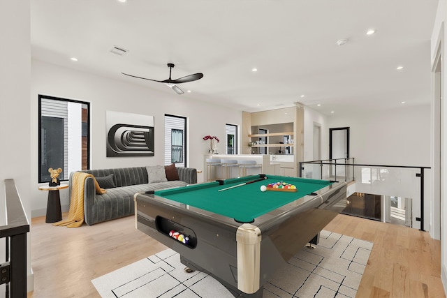 rec room featuring light wood-type flooring, ceiling fan, and billiards