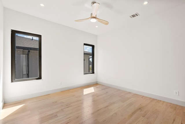 unfurnished room with ceiling fan and light wood-type flooring