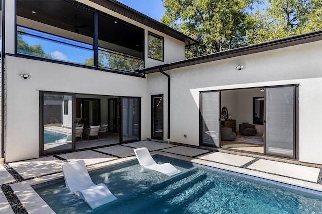 rear view of house with a patio