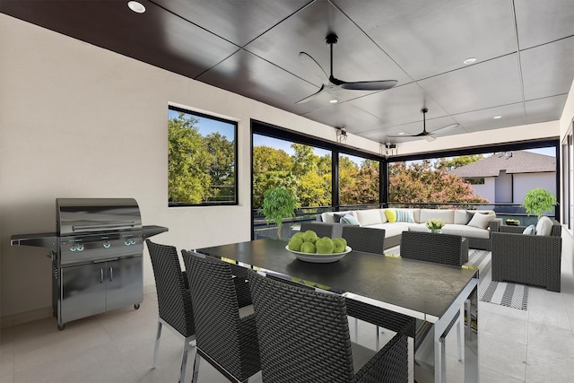 interior space with ceiling fan, an outdoor hangout area, and a grill