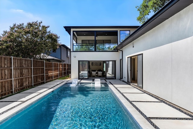 view of swimming pool featuring a patio area