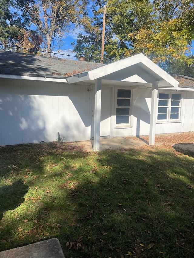 view of home's exterior with a yard