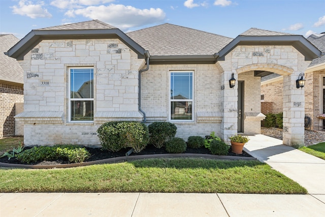 french country home with a front yard