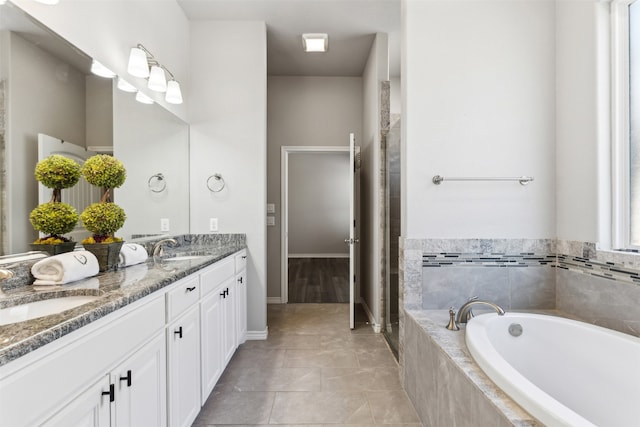 bathroom featuring vanity, shower with separate bathtub, and tile patterned flooring