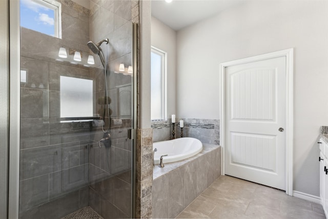 bathroom with vanity, shower with separate bathtub, and tile patterned flooring