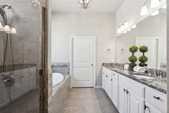 bathroom featuring vanity, shower with separate bathtub, and tile patterned flooring