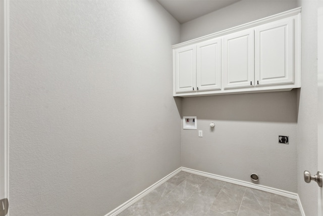 laundry area featuring gas dryer hookup, hookup for an electric dryer, cabinets, and hookup for a washing machine