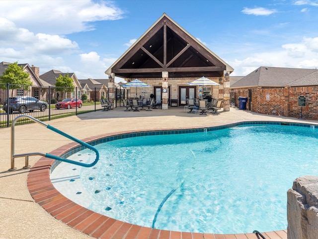 view of swimming pool with a patio