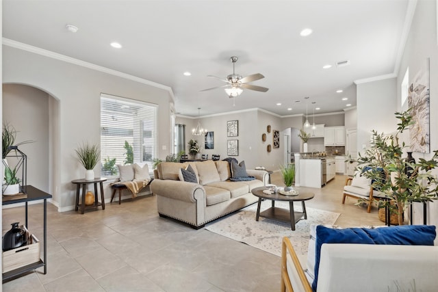 tiled living room featuring ornamental molding and ceiling fan with notable chandelier