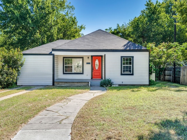 view of front of property with a front lawn