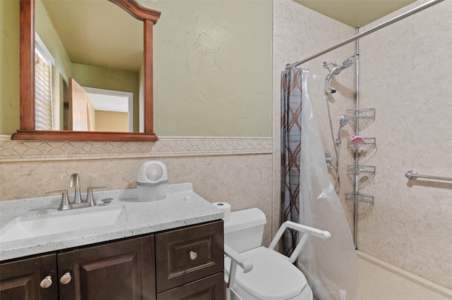 bathroom with vanity, tile walls, and toilet