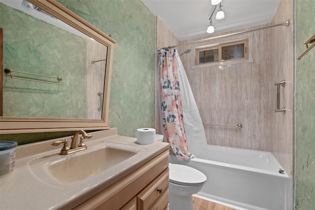 full bathroom featuring vanity, wood-type flooring, shower / tub combo, and toilet