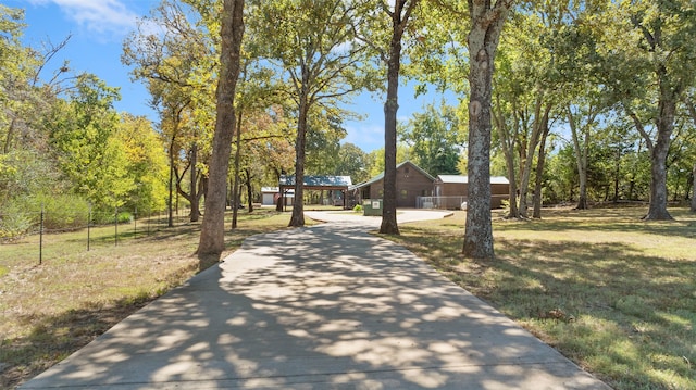 view of property's community with a yard