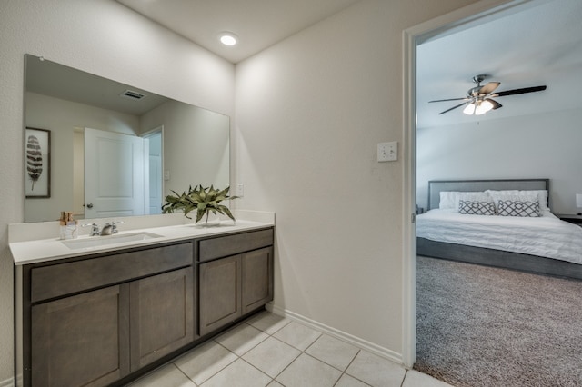 bathroom featuring vanity, ceiling fan, and tile patterned floors