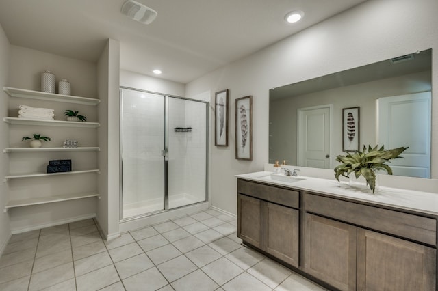 bathroom with vanity, tile patterned floors, and an enclosed shower