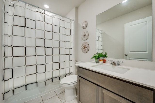 full bathroom featuring shower / tub combo with curtain, tile patterned flooring, vanity, and toilet