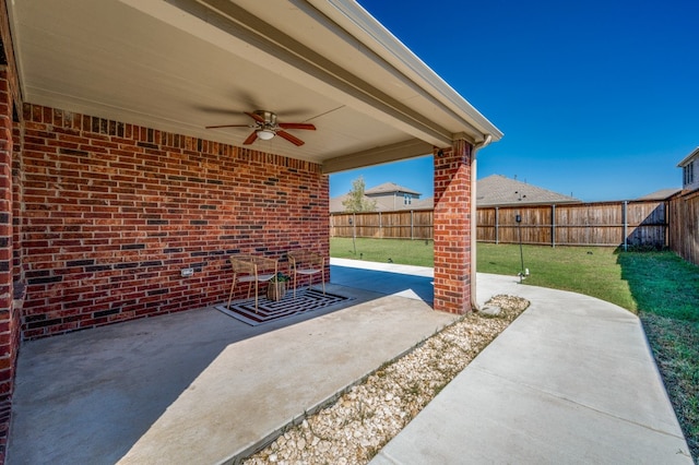 view of patio featuring ceiling fan