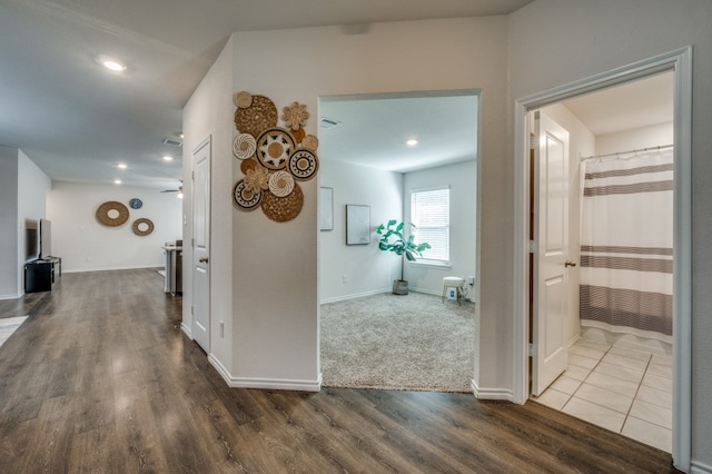 corridor featuring hardwood / wood-style floors