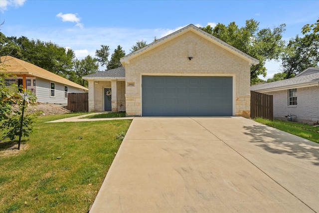 ranch-style house with a front yard and a garage