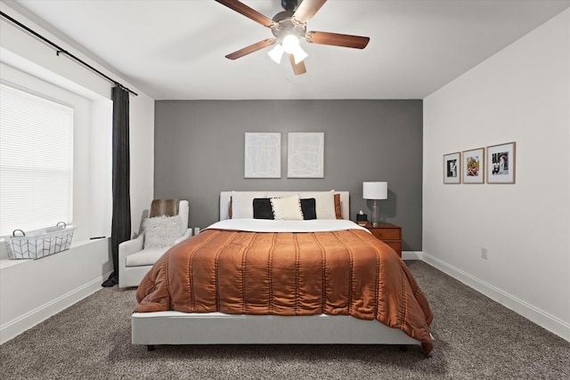 bedroom featuring ceiling fan and dark colored carpet