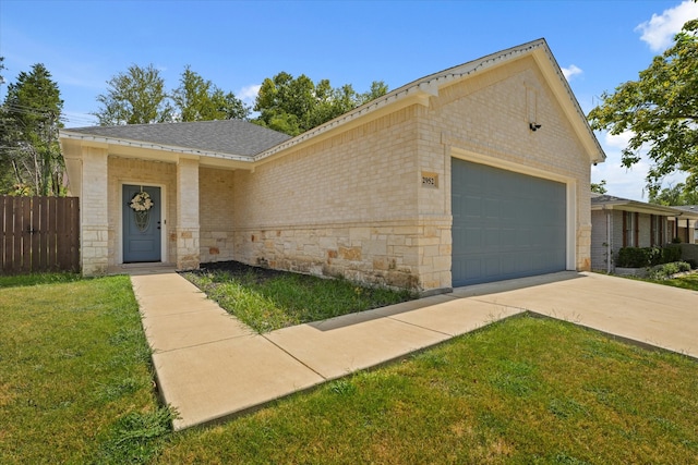 ranch-style house with a front yard and a garage