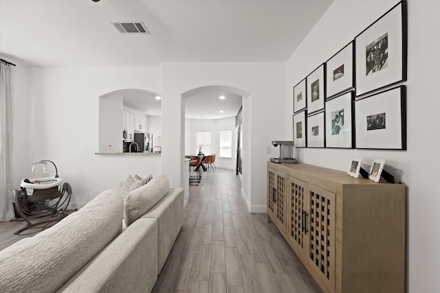 hallway featuring light hardwood / wood-style floors