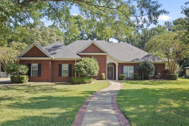 ranch-style home with a front yard