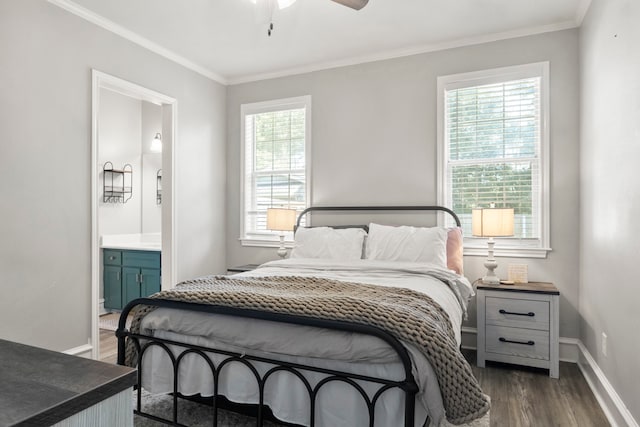 bedroom with ensuite bath, multiple windows, ceiling fan, and dark hardwood / wood-style flooring