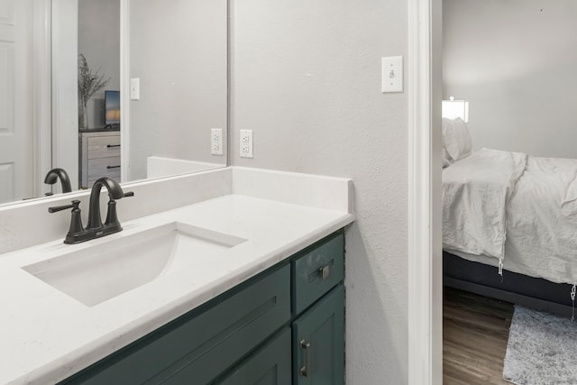 bathroom featuring vanity and hardwood / wood-style floors