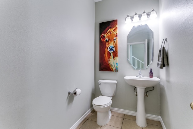 bathroom with tile patterned floors and toilet