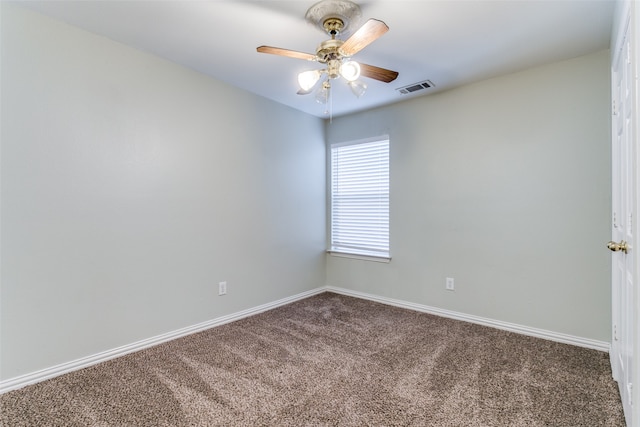 carpeted empty room featuring ceiling fan