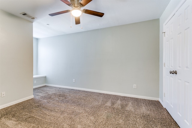 unfurnished bedroom featuring carpet, ceiling fan, and a closet