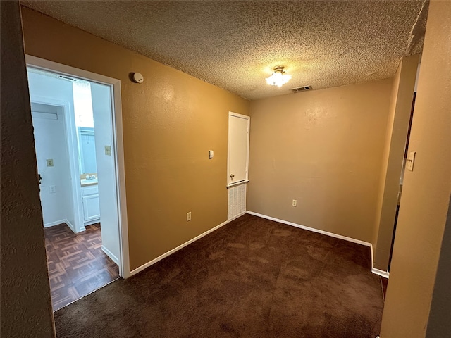 interior space with a textured ceiling