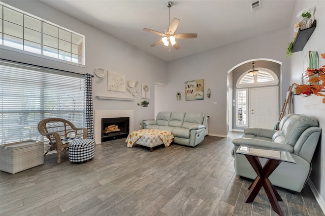 living room with a healthy amount of sunlight, ceiling fan, and wood-type flooring