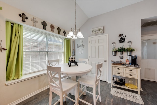 dining space featuring vaulted ceiling, dark wood-type flooring, and a notable chandelier