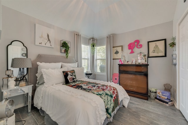 bedroom with hardwood / wood-style flooring