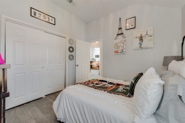 bedroom with hardwood / wood-style flooring and a closet