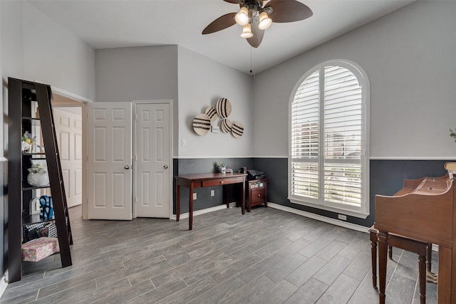 office with hardwood / wood-style floors, ceiling fan, and a healthy amount of sunlight