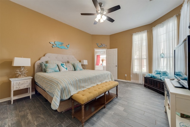 bedroom with ceiling fan and hardwood / wood-style flooring