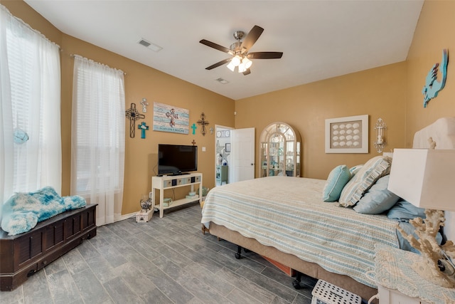 bedroom with wood-type flooring and ceiling fan