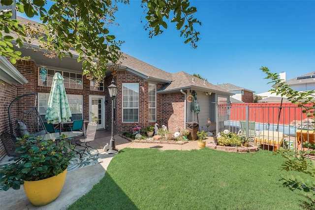 exterior space featuring a patio area and a yard