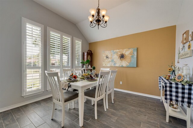 dining space with lofted ceiling, a chandelier, dark wood-type flooring, and a wealth of natural light