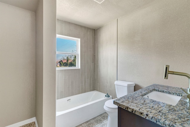 full bathroom featuring a textured ceiling, tiled shower / bath combo, vanity, and toilet