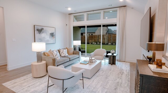 living room with light hardwood / wood-style flooring