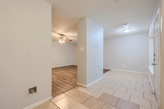 empty room featuring light hardwood / wood-style floors and ceiling fan