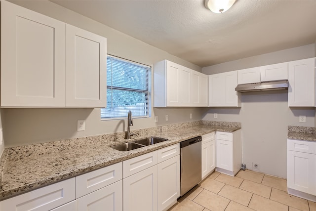 kitchen featuring a textured ceiling, white cabinetry, dishwasher, and sink